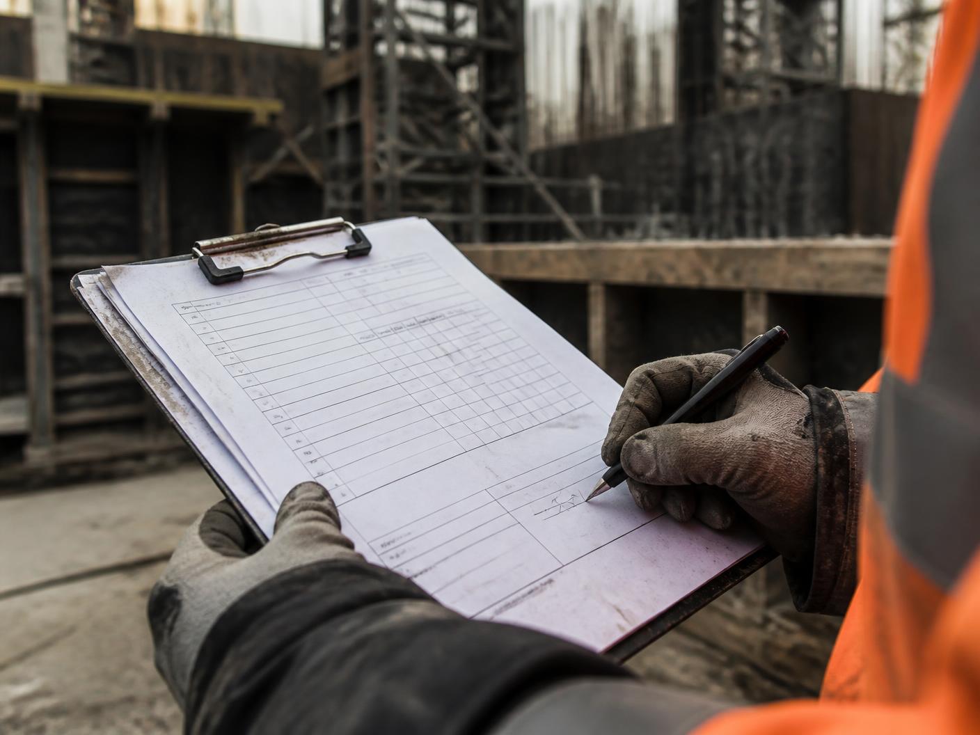 Written safety program documentation being reviewed at a construction project